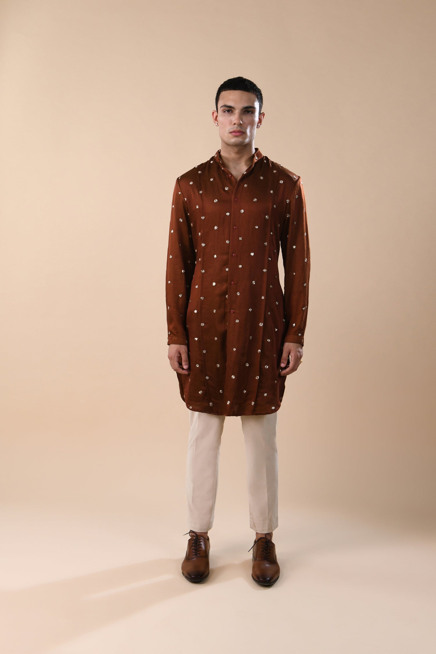  OUTSPREAD MIRROR HIGHLIGHTED PANNELED RUST KURTA 