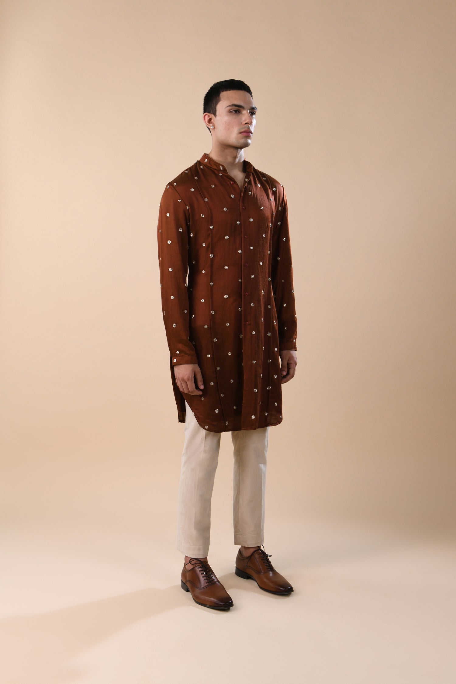 OUTSPREAD MIRROR HIGHLIGHTED PANNELED RUST KURTA  