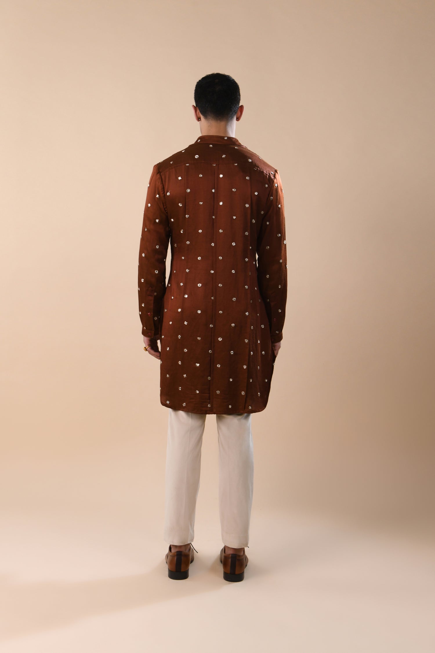 OUTSPREAD MIRROR HIGHLIGHTED PANNELED RUST KURTA  